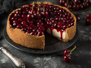 cherry cheesecake on dark background, selective focus
