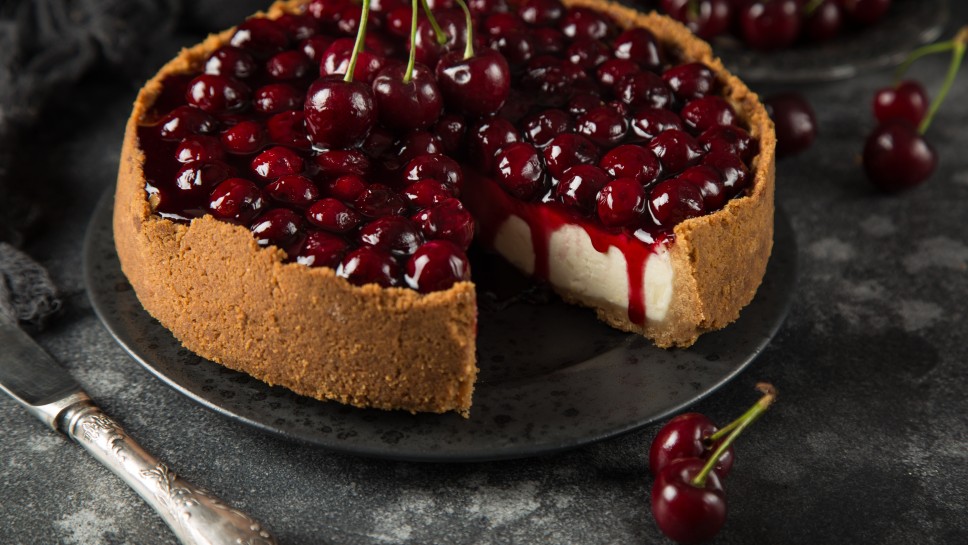 cherry cheesecake on dark background, selective focus